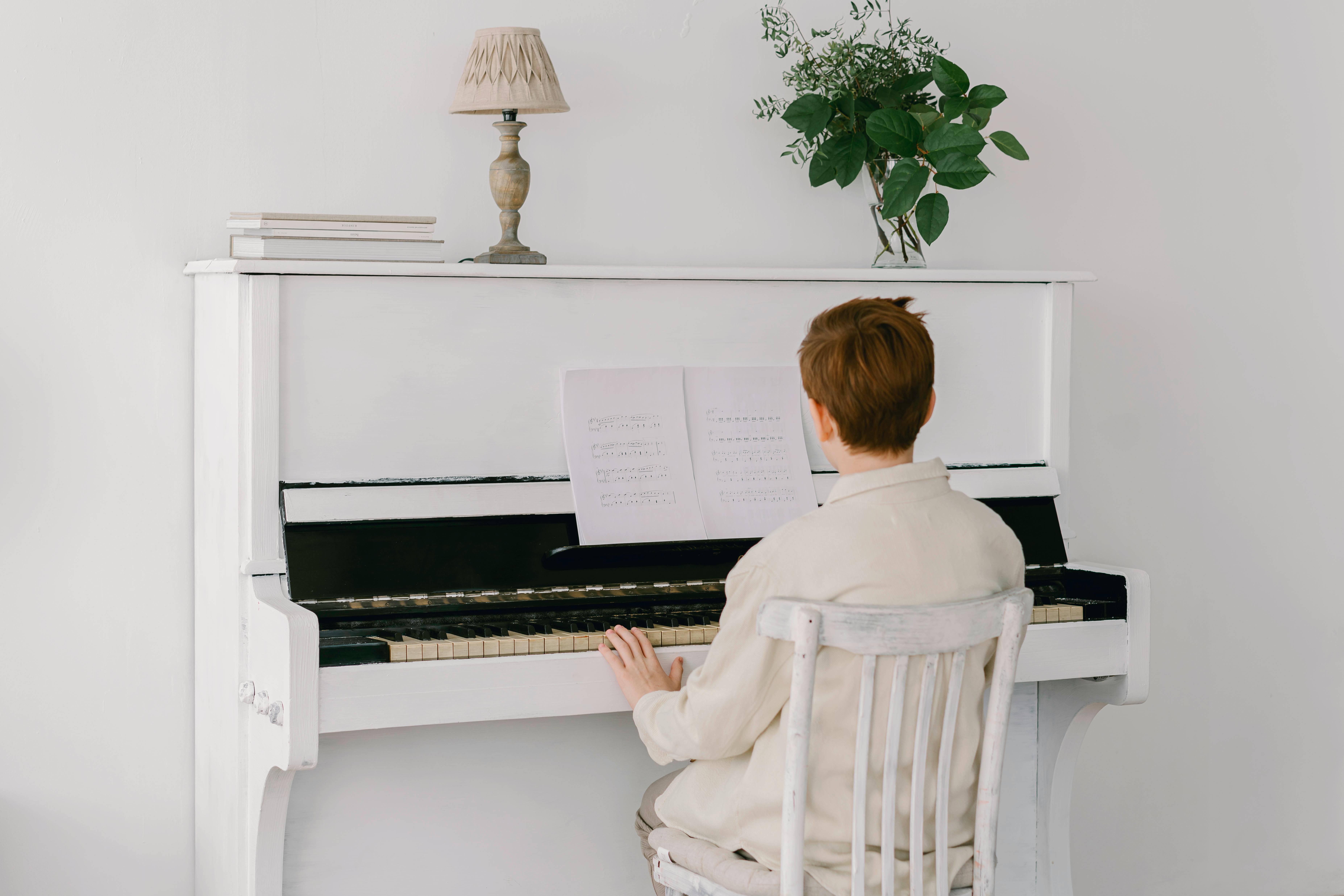 Young boy playing piano